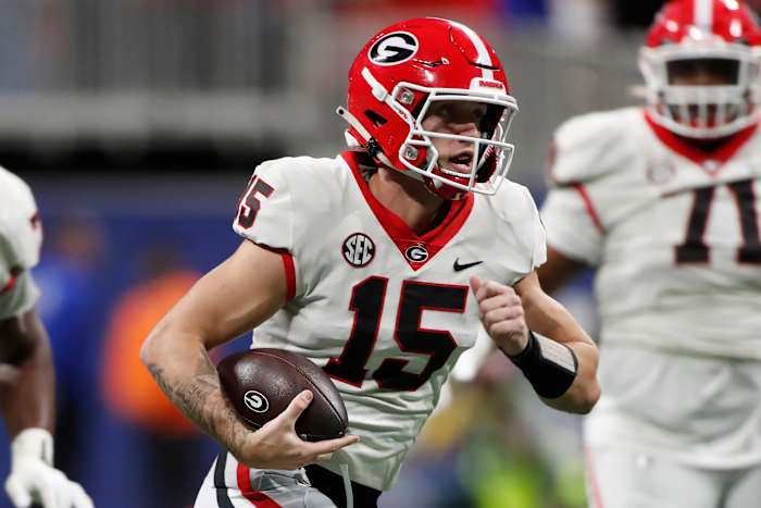 Georgia quarterback Carson Beck (15) runs the ball during the first half of the SEC Championship game against Alabama at Mercedes-Benz Stadium in Atlanta, on Saturday, Dec. 2, 2023.
